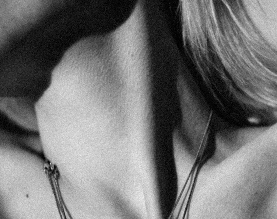 black and white photo of woman's neck